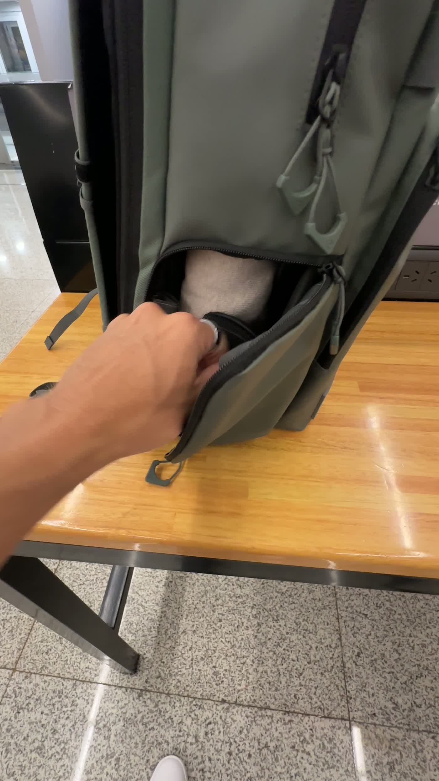 Quick side access pocket on the WANDRD PRVKE Pocket 21L for camera gear